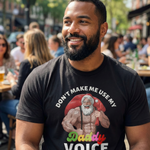 smiling man wearing a black ‘Don’t Make Me Use My Daddy Voice’ t-shirt while sitting outdoors at a busy café