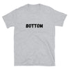 Grey t-shirt with bold 'BOTTOM' text, fitting for gay pride apparel.