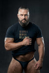 Muscular man wearing a black shirt with 'Beards Bears Belly Rubs' text, showcasing gay pride apparel.