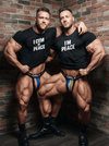 Funny Gay Couple Matching Shirt - Raunchy Tees: I Cum In Peace I'm Peace worn by muscular men.