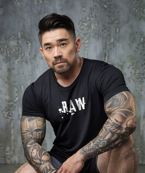 Male model wearing a black Funny Gay Design Raw Daddy Twink & Jock Gay Shirt.