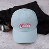 Light blue dad cap with embroidered 'Daddy' text, gay pride apparel, trendy accessory.