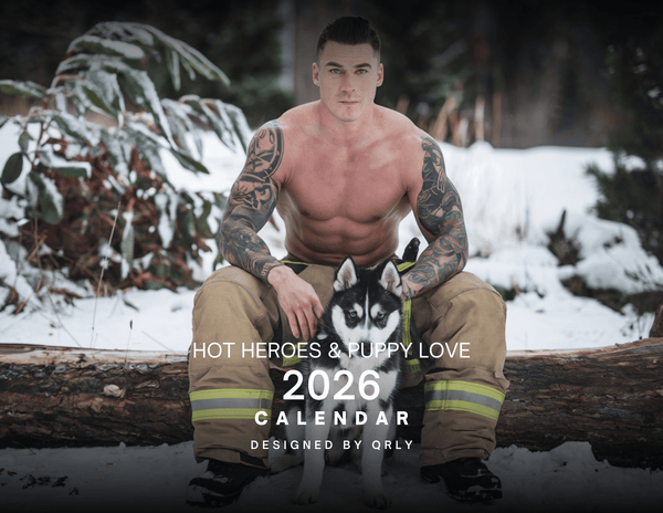 Muscular firefighter in pants with a husky, promoting Hot Heroes & Puppy Love 2026 Calendar.