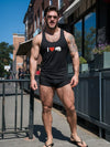 Male model wearing I Love (Heart) Bear Tank Top and shorts outdoors, showcasing gay pride apparel.