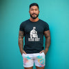 Model wearing black LGBT Gay Pride Bear Bait muscle bear shirt with graphic design.