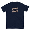 Navy blue gay shirt featuring "Cruising for a Bruising" humorous text design.