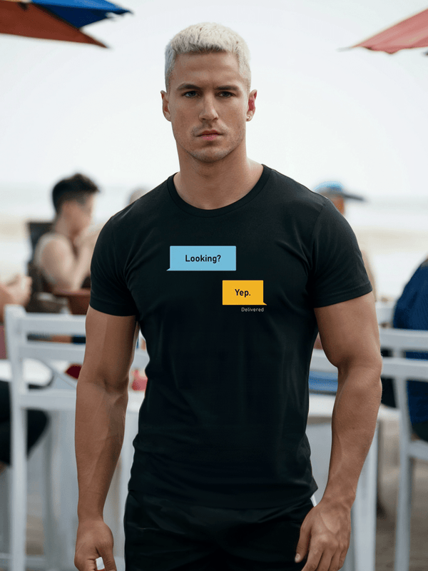Model wearing Looking? Yep. Grindr Dialogues LGBT Shirt in black, showcasing humor and pride.