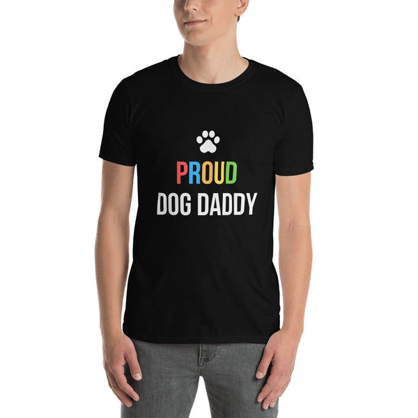 Man wearing a black shirt with colorful 'PROUD DOG DADDY' text and paw print. LGBT apparel.