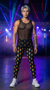 Person wearing a sheer top and colorful pants with laser lights in the background