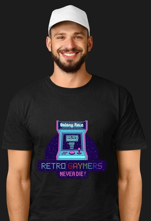 Man wearing a Retro Gaymers Never Die T-Shirt with arcade game graphic.