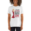 Woman wearing a white gay shirt featuring Ru Paul Love Yourself Quote design.