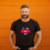Black gay shirt featuring bold text 'TREAT YOUR MAN RIGHT', model with beard, vibrant orange background.