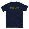 Navy blue shirt with bold yellow text '0 FEET AWAY', ideal gay pride apparel.
