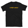 Black gay shirt featuring bold yellow text "0 FEET AWAY"," perfect for pride events.
