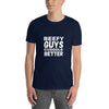 Model wearing navy t-shirt with 'Beefy Guys Cuddle Better' text, gay pride apparel.