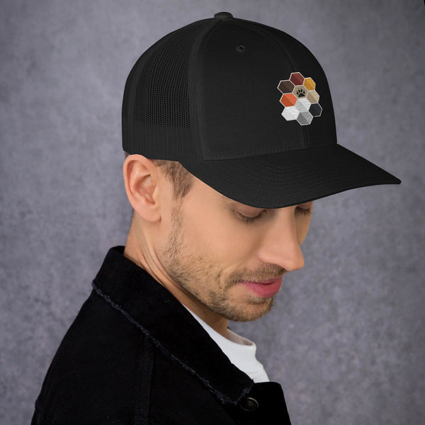 Stylish trucker cap with hexagon graphic design, perfect for gay pride apparel.