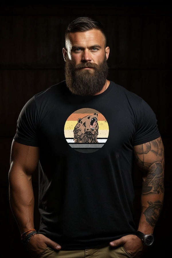 Muscular man wearing a t-shirt featuring a bear design in pride flag colors.