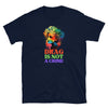 Dark t-shirt featuring colorful design: 'Drag Is Not A Crime' statement, LGBT pride apparel.