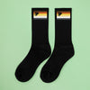 Bear Pride Socks | Subtle Bear Brotherhood Crew Socks with black base and colorful paw print design.