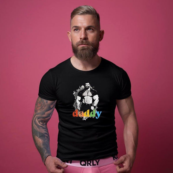 Man wearing gay shirt with vintage Leather Daddy design on plain black fabric.
