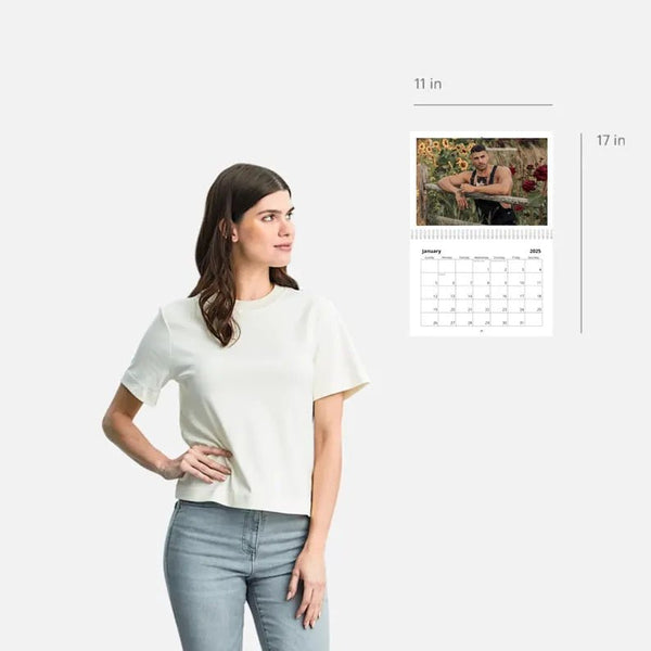 Model displaying a white shirt next to a Sexy Firefighter Hunks calendar.