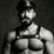“Bearded muscular man wearing a leather harness and cap, posing confidently against a dark textured background, holding a cigar. Styled in classic leather-fetish aesthetic often seen in bear, kink, and queer fashion culture.