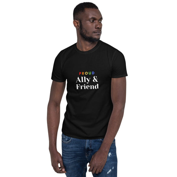 Man wearing a black LGBTQ pride shirt with colorful text design.