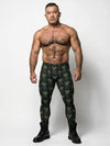 Man wearing Toxic Reaper Men’s Leggings with radioactive skull design, black and green colors.
