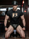 Muscular model in a vintage Dom daddy gay shirt and leather gear.
